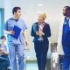 Nurses walking in the hall and talking.